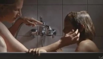 Mother takes bath with her son and masturbates her clit with his hand