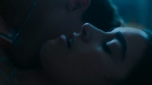 Asha Banks passionate bedroom kissing with hands on face in My Fault London 2025, dim interior lighting, emotional and steamy