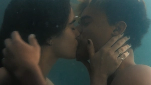 Asha Banks close-up sensual face during underwater or pool kiss My Fault London 2025, blue tones, dreamy erotic mood.