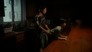 Airi Aoki intimate sexual scene from Naomi Reversed (2024), woman on kitchen counter in suggestive position