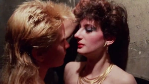 Sharon Mitchell and Mantra full nude breasts and bush in explicit lesbian sex scene from Kamikaze Hearts 1986 - img #1