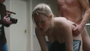 Topless Helena Braithwaite in intimate pose being filmed - behind-the-scenes shot from Truly Naked (2026).