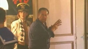 Topless Anna Galiena in full frontal view from Black Angel (2002), breasts exposed in sex scene with older shirtless man from behind. - img #8