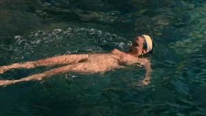 Jasmine Trinca nude swimming pool scene in Gli occhi degli altri 2025 - actress floating on back full body visible wearing swim cap