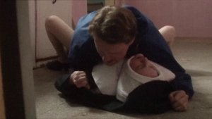 Sex  scene with a nun on a tiled floor from Masked Avenger Versus Ultra-Villain in the Lair of the Naked Bikini (2000).