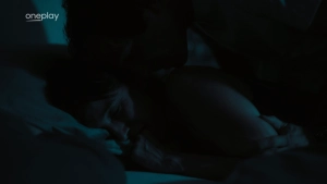 Tereza Voriskova nude intimate scene in Monyová, close-up of passionate embrace and dramatic lighting.