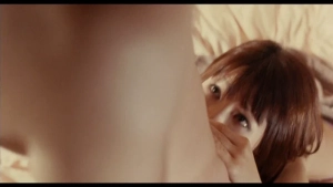 Blow job  close-up scene from Toraware no injû (2011) featuring Riri Kôda in a bedroom setting.