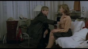 Intimate close-up of Benno Fürmann and Isabelle Huppert in sex scene from The Piano Teacher (2001).