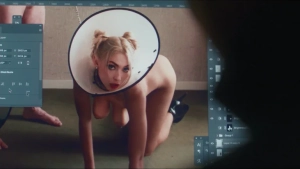 Topless blonde woman in white cone crawling on floor - meta shot inside editing software from Truly Naked (2026).