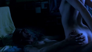 Jacqueline McKenzie showing rear nudity in a sex scene in a bedroom from Romper Stomper (1992)