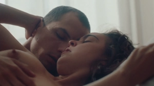 Katia Borlado topless in a sex scene, lying on her back with Álvaro Quintana in a bedroom from Notes on a Summer (2023)