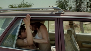 Maribel Verdú in underwear in a sex scene, on her lover's lap in a car from Y Tu Mamá También (2001)