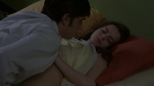 Roxane Mesquida in see-through clothing in a sex scene with Libero De Rienzo in a bedroom from Fat Girl (2001)